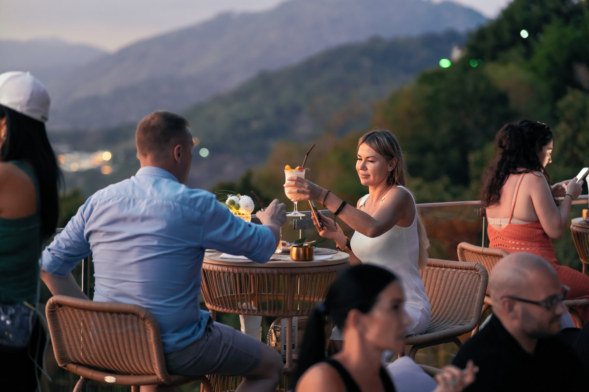 Couples toasting at sunset