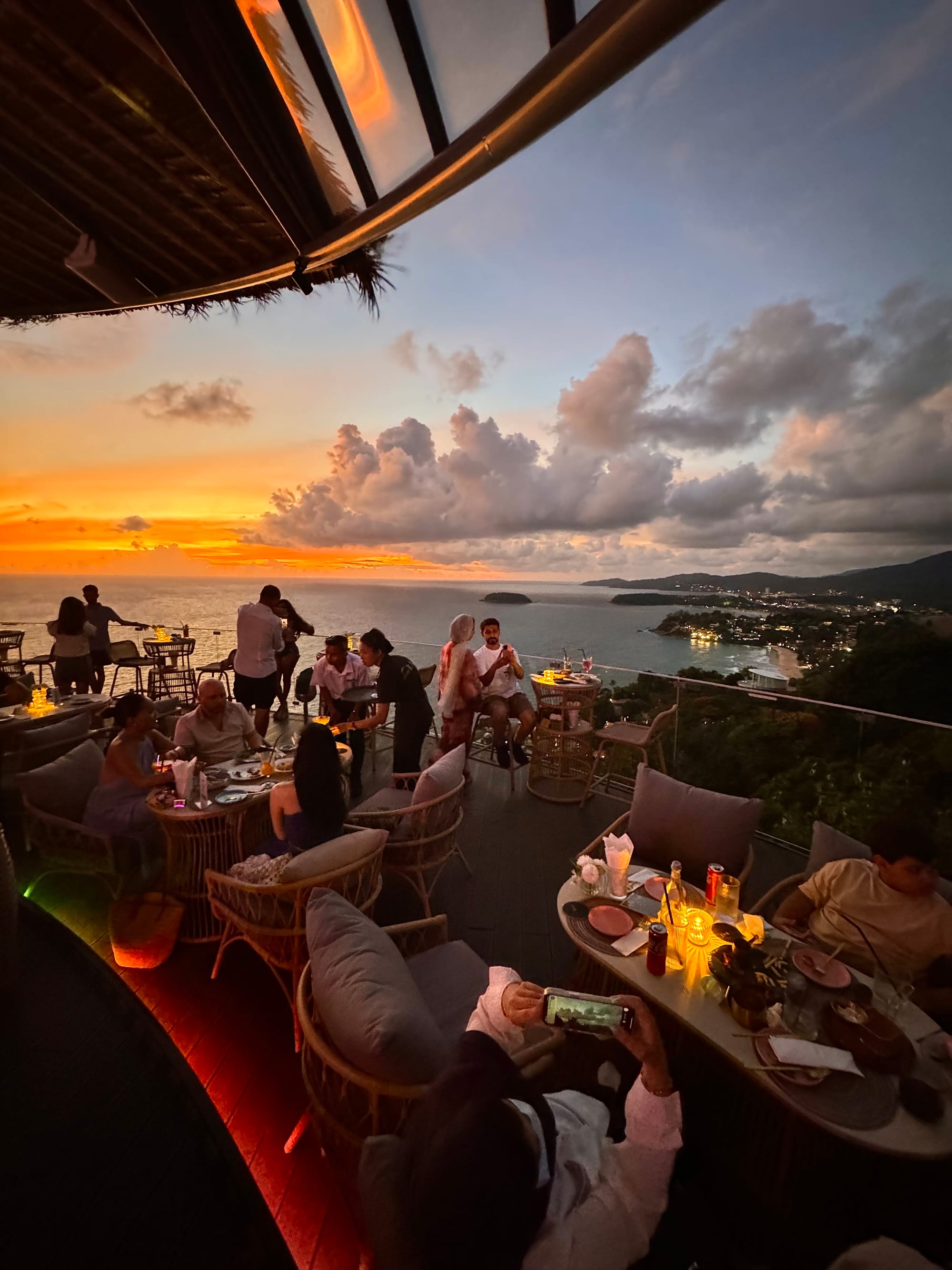 Guests celebrating at sunset at Tree Bay Clubhouse